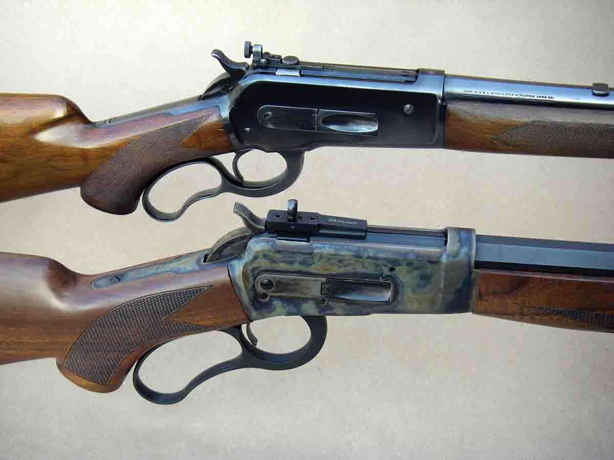 The (top) Winchester Model 71 and the (bottom) Big Horn Armory Model 90A share a similar profile with curved-finger levers and bolt-mounted sights.